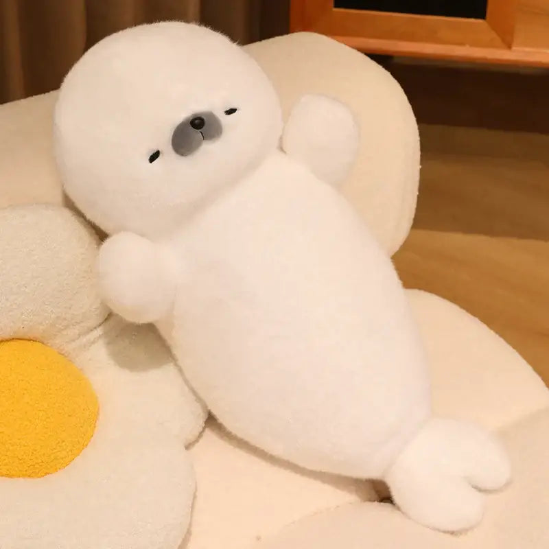peluche loutre sommeil