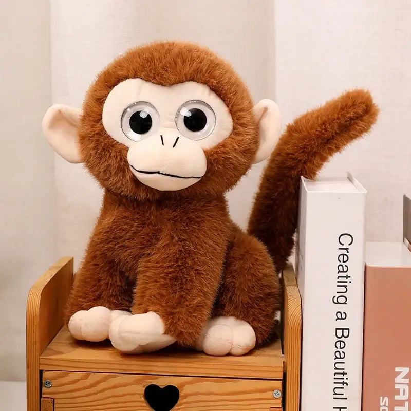 peluche gros yeux singe