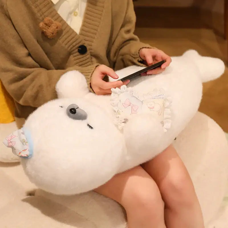 peluche loutre sommeil