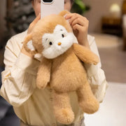 peluche singe marron