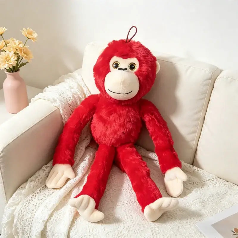 peluche singe rouge