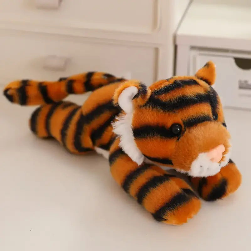 peluche tigre couché