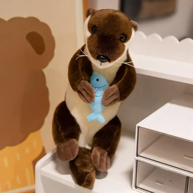 petite loutre peluche - Couché