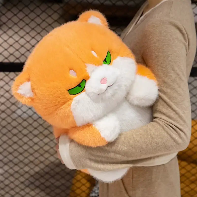 chat roux en peluche