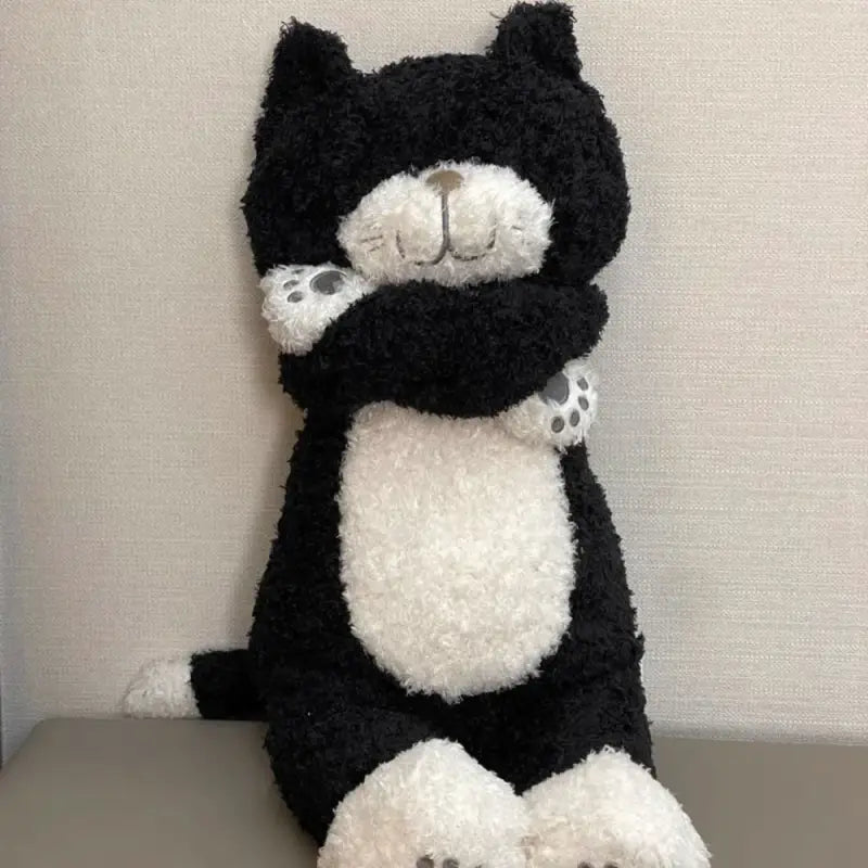 chat en peluche noir et blanc