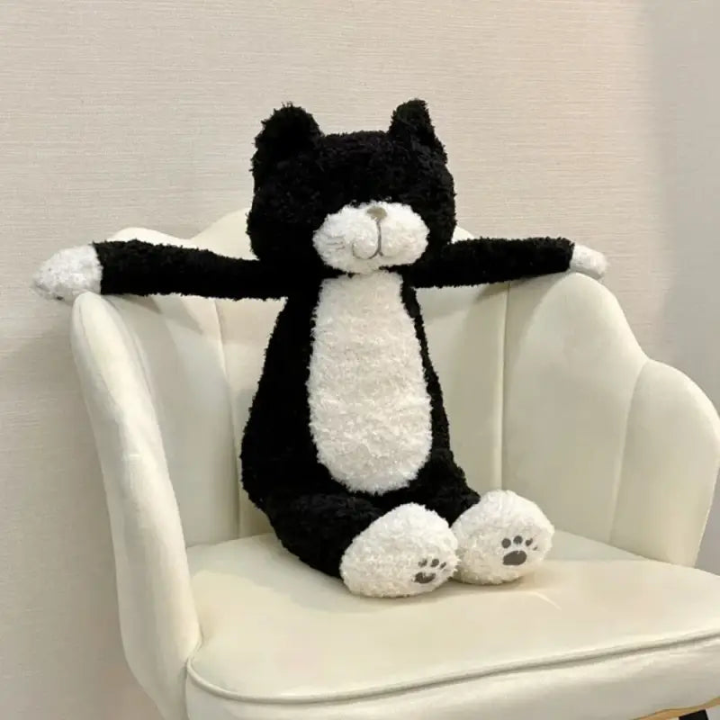 chat en peluche noir et blanc