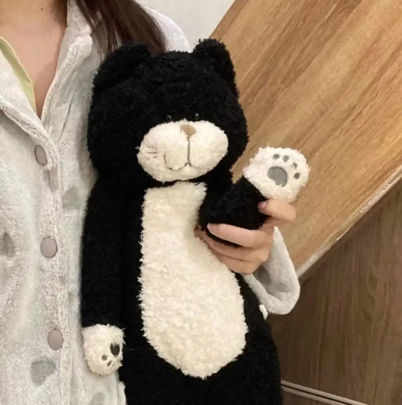 chat en peluche noir et blanc