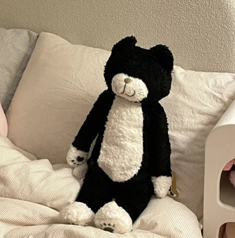chat en peluche noir et blanc