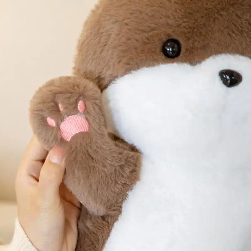 peluche loutre qui dort